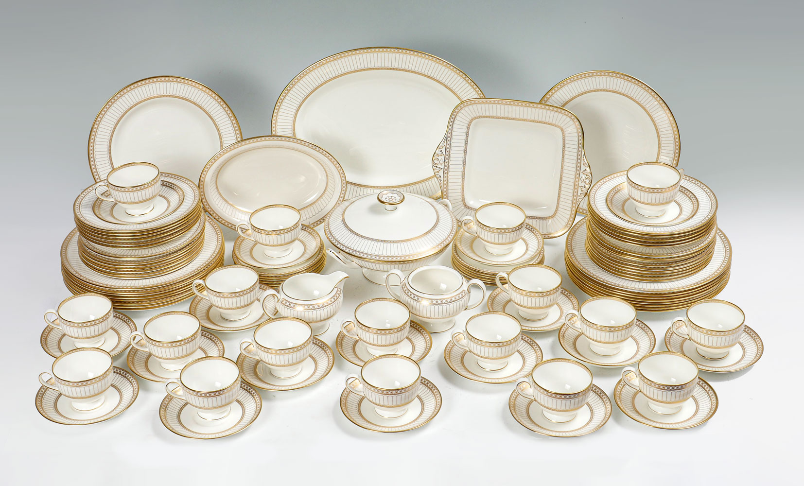 Appraisal: LARGE WEDGWOOD COLONNADE GOLD CHINA SET dinner plates salad plates