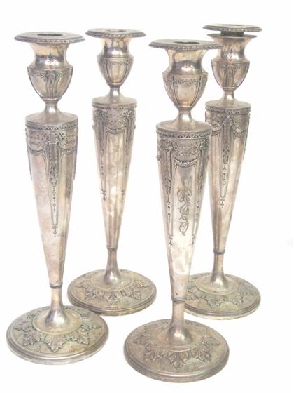 Appraisal: Set of four sterling silver weighted base candlesticks early th