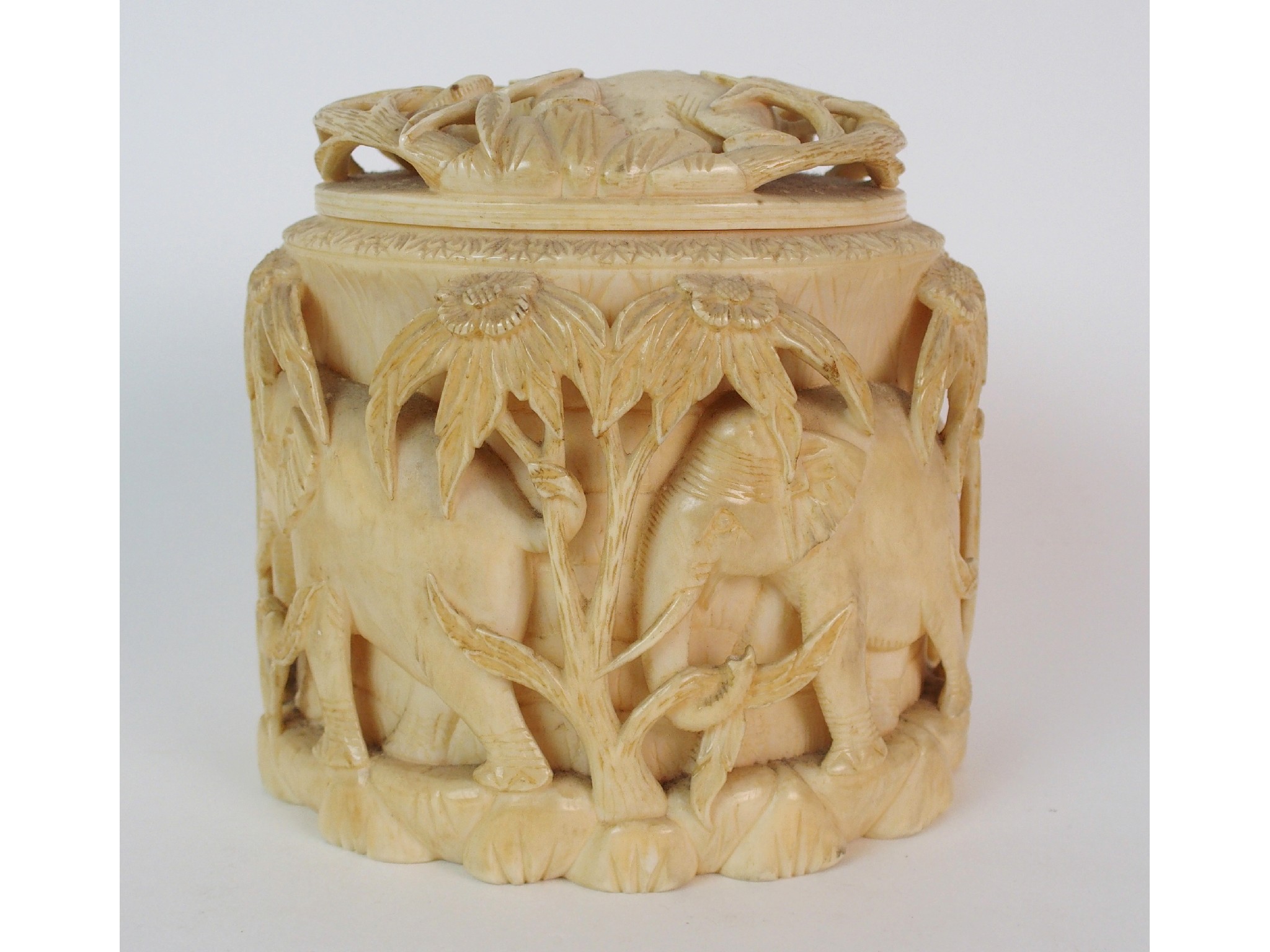 Appraisal: An African ivory tusk box and covercarved with a procession