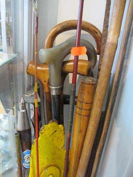 Appraisal: A COLLECTION OF ASSORTED WALKING STICKS FISHING RODS TOOLS ETC