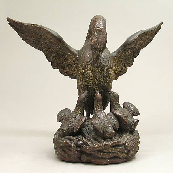 Appraisal: A polychrome and parcel gilt carved walnut Pelican in her