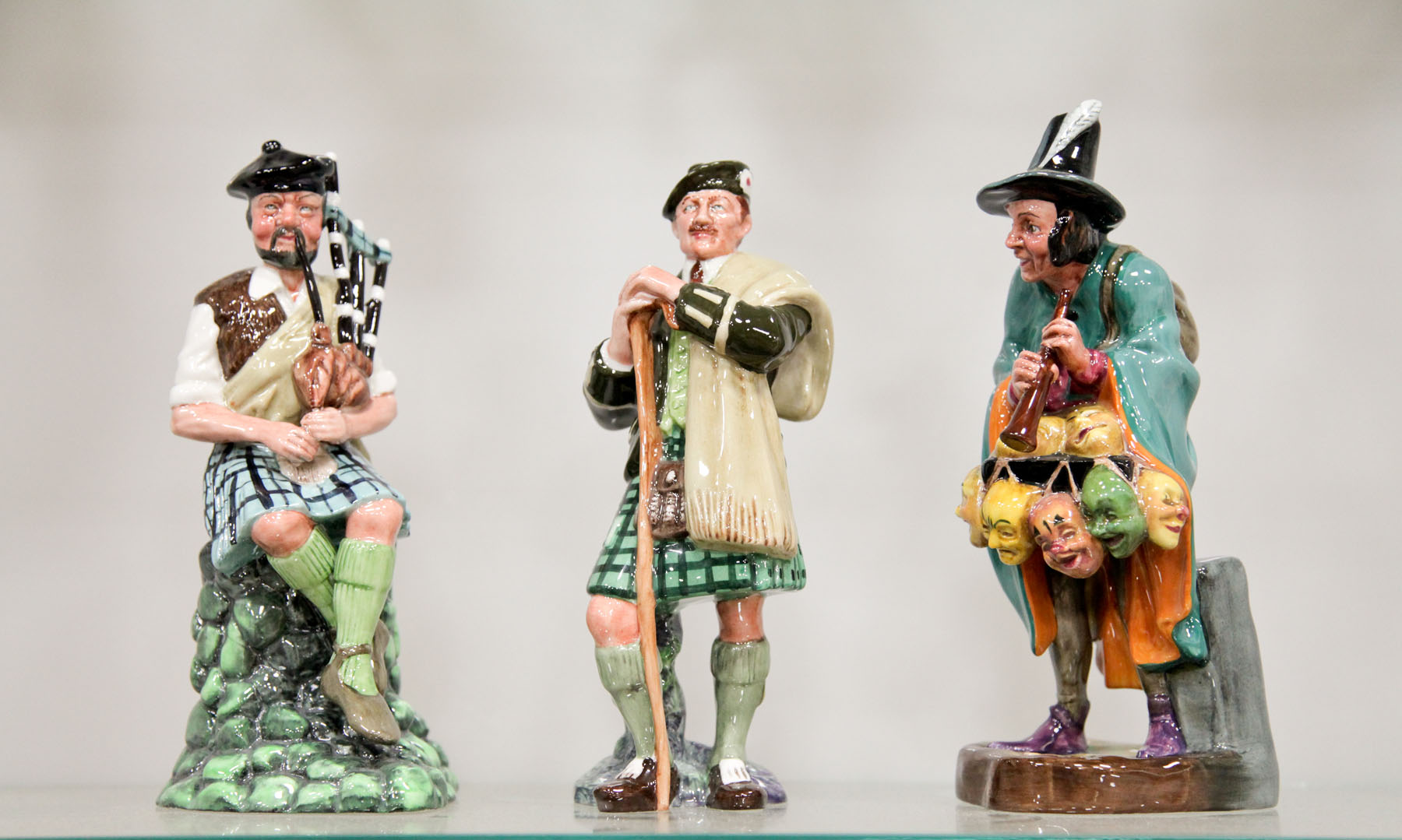 Appraisal: THREE ROYAL DOULTON FIGURINES England mid to late th century