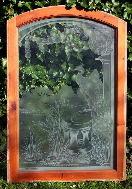 Appraisal: A GROUP OF THREE ENGRAVED GLASS WINDOWS in arching pine