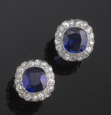 Appraisal: A pair of sapphire and diamond cluster earrings The cushion