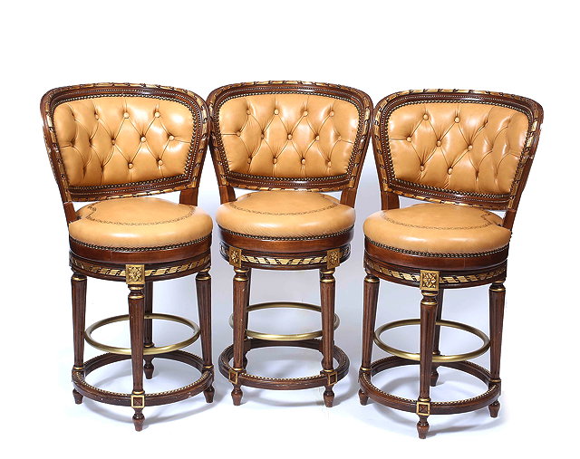 Appraisal: A SET OF THREE FRENCH STYLE ROTATING HIGH STOOLS with