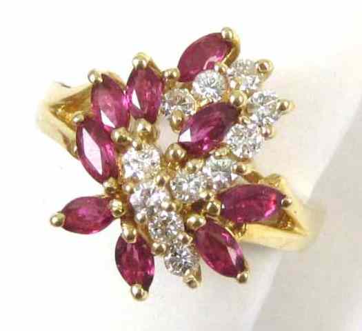 Appraisal: RUBY DIAMOND AND FOURTEEN KARAT GOLD RING with a cluster