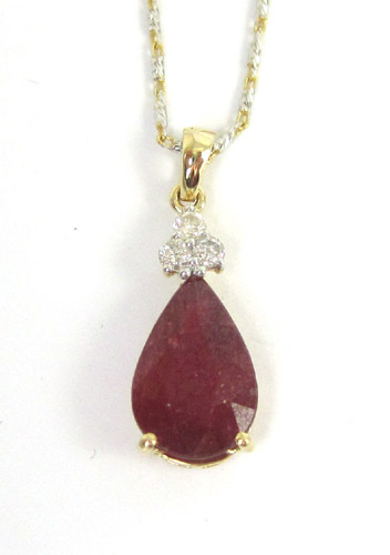 Appraisal: RUBY AND DIAMOND PENDANT NECKLACE with appraisal Suspended on an