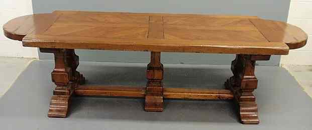 Appraisal: Italian fruitwood trestle table with a shaped and pinned constructed