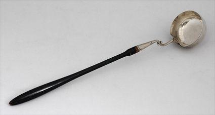 Appraisal: CONTINENTAL EBONIZED WOOD HANDLED SILVER LADLE impressed marks the oval