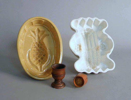 Appraisal: Two pottery molds together with a miniature butter stamp and