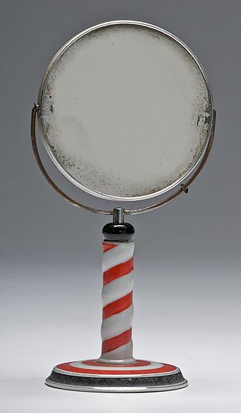 Appraisal: SHAVING MIRROR ON ENAMELED STAND two-sided mirror on red and