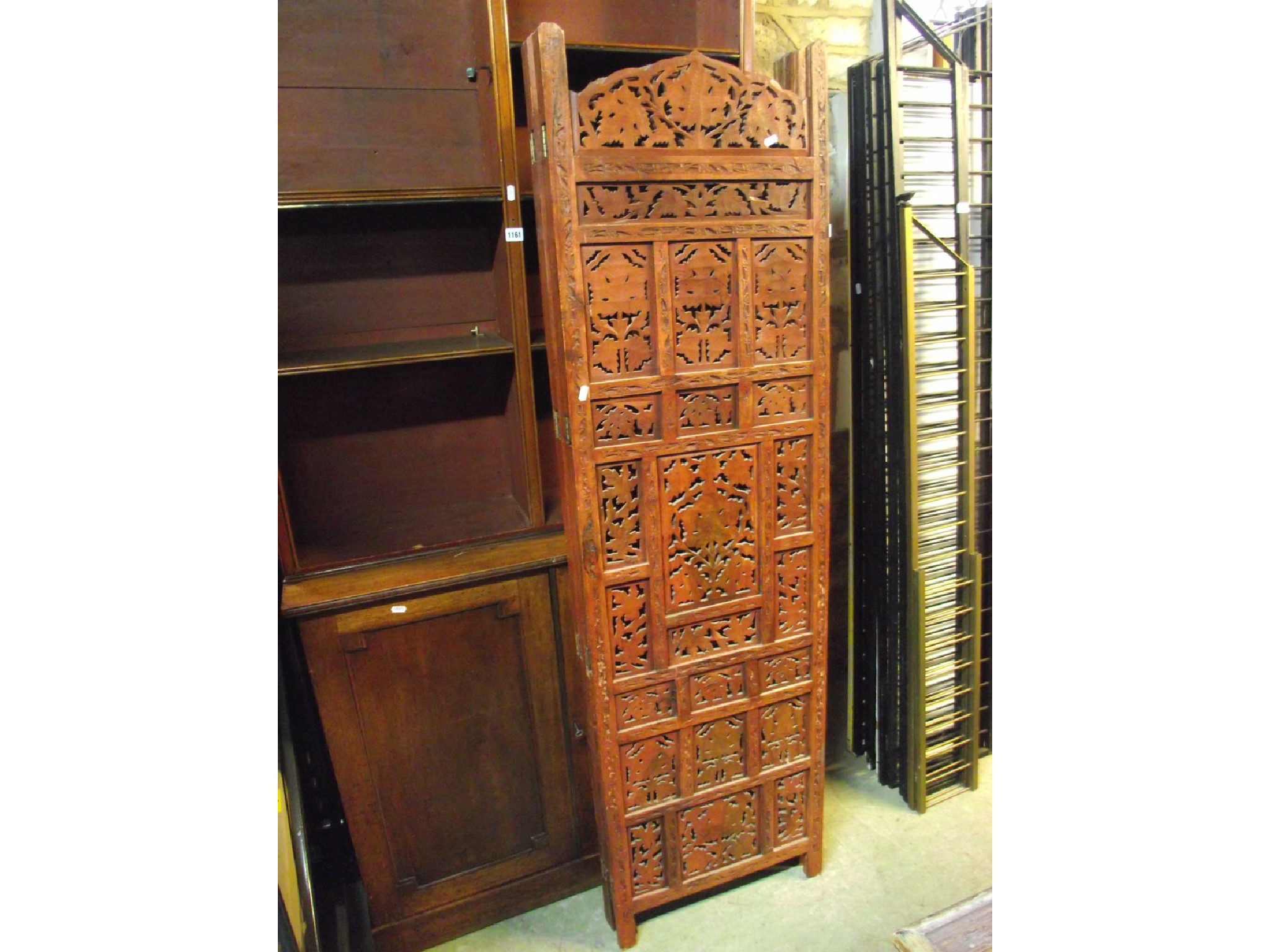 Appraisal: An Eastern hardwood freestanding four fold screen the panelled framework