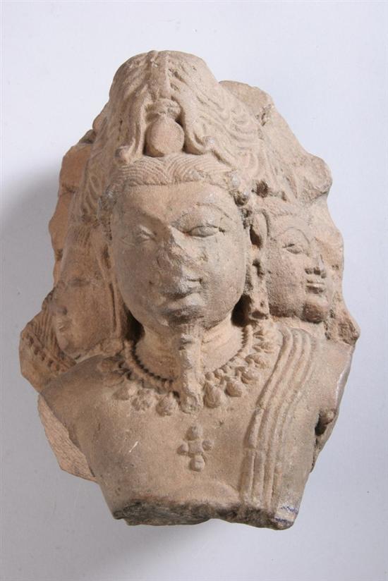 Appraisal: INDIAN STONE TRI-HEADED DEITY Circa th century Wearing high chignon