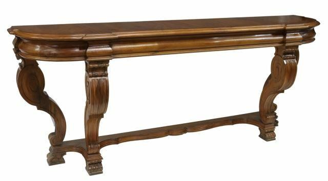 Appraisal: Large Neoclassical style walnut console table th c shaped top