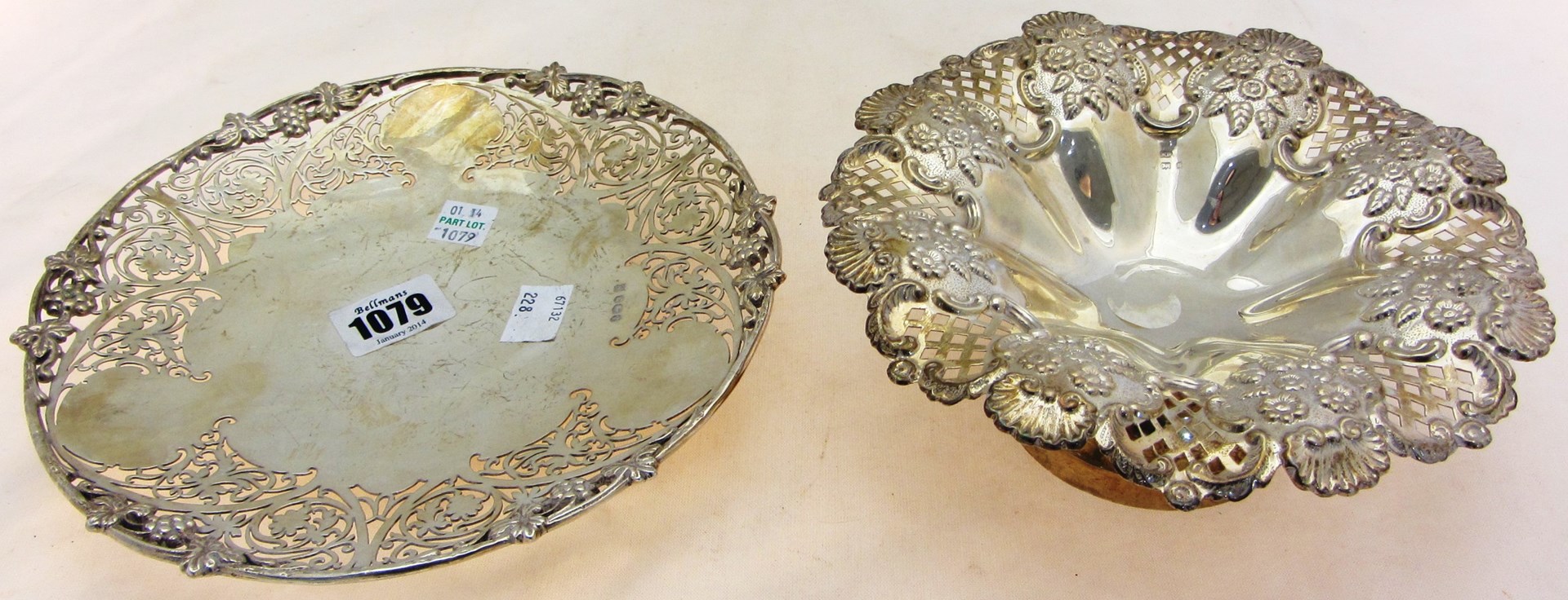 Appraisal: A silver shaped circular dish decorated with a pierced border