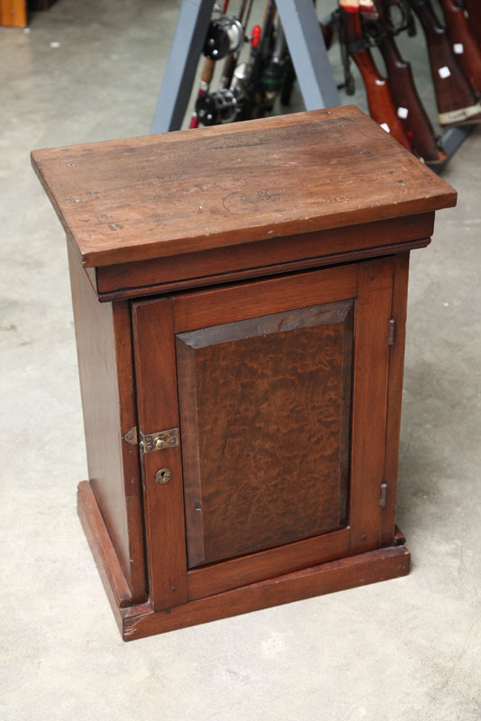 Appraisal: SMALL SINGLE DOOR CABINET Walnut with an incised cornice raised