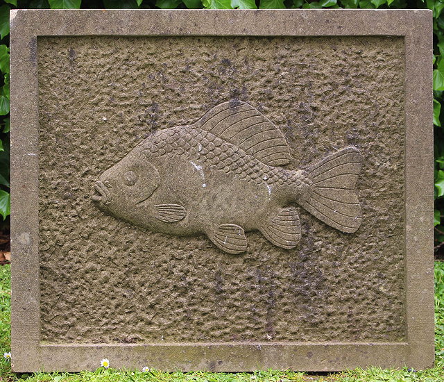 Appraisal: A HAND CARVED RECTANGULAR STONE PLAQUE of a carp with