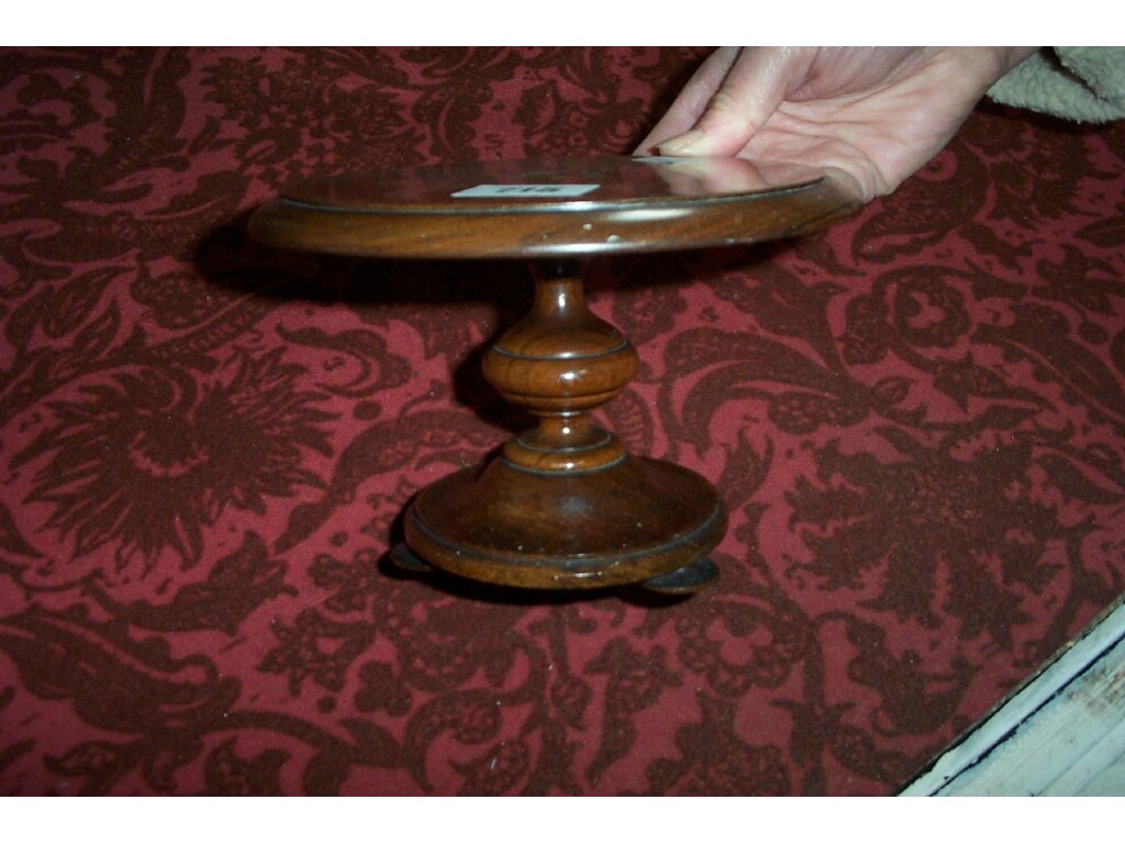 Appraisal: A th century rosewood miniature breakfast table with concentric circle