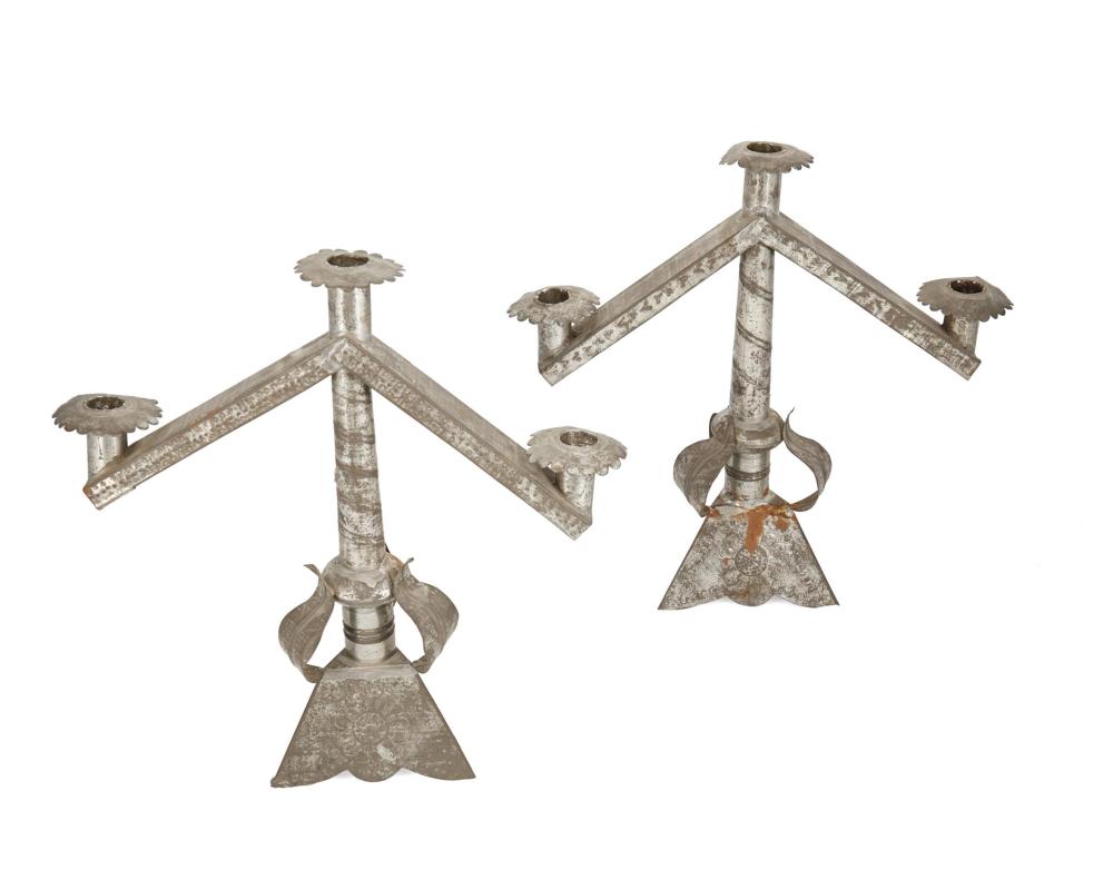 Appraisal: A pair of sand-weighted tin candelabra Circa s Mexico Each