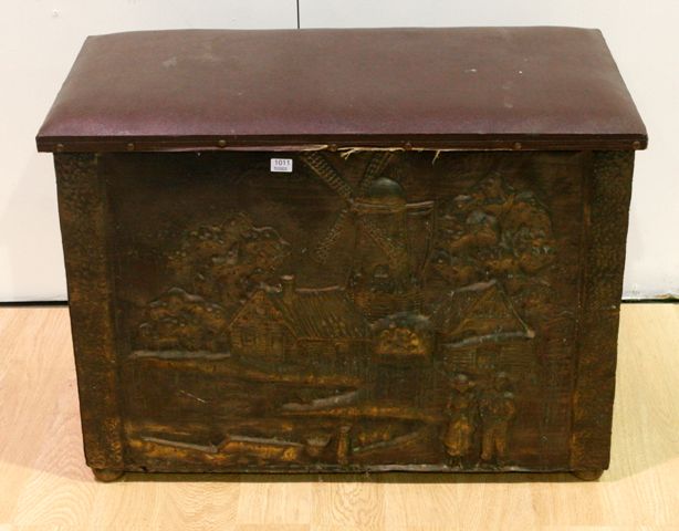 Appraisal: A Dutch Ropousse decorated brass and timber fireside box