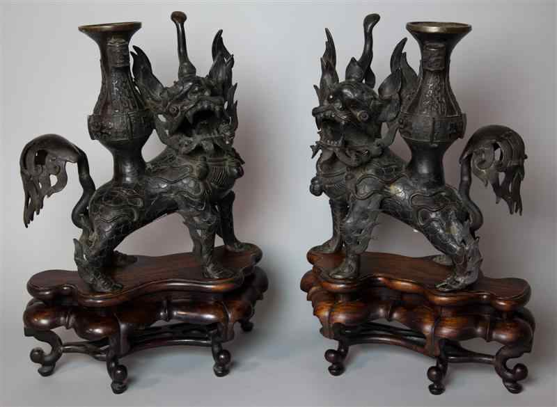 Appraisal: PAIR OF CHINESE BRONZE MODELS OF BUDDHISTIC LIONS circa the