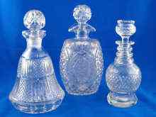 Appraisal: Three cut glass decanters one an oval barrel one a