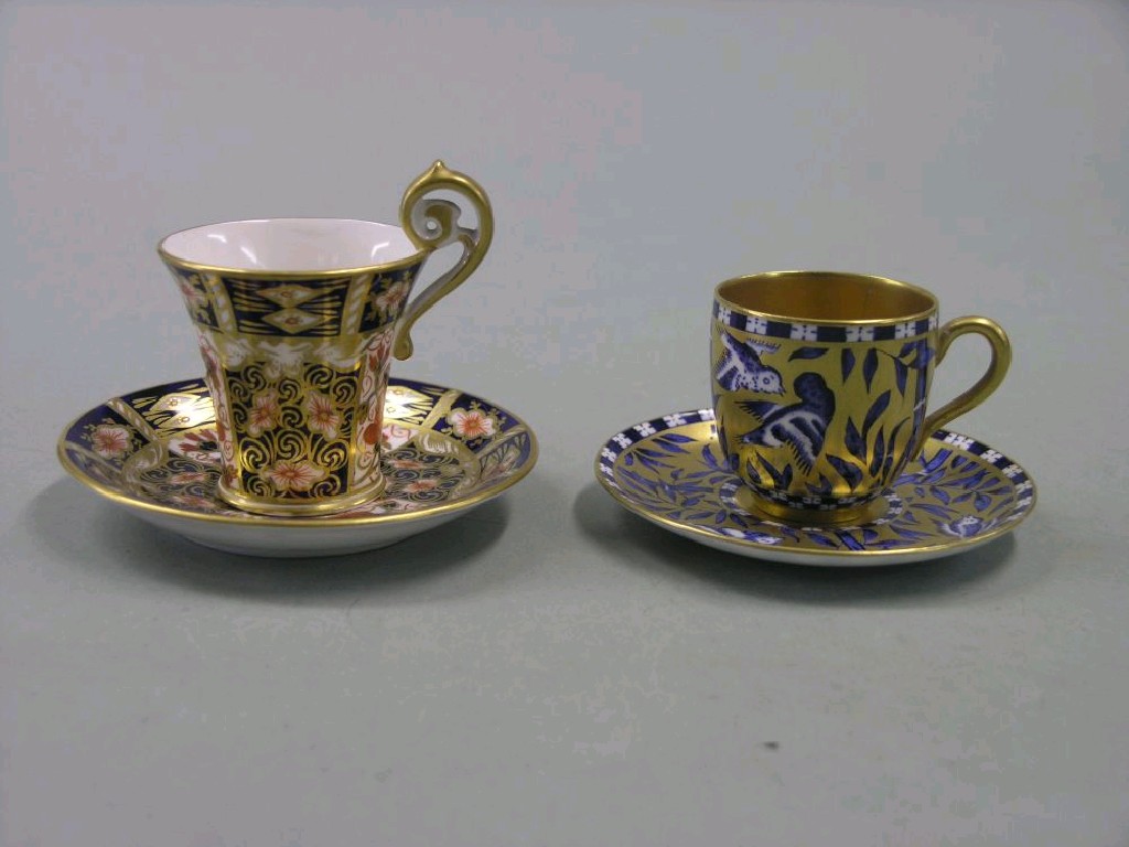 Appraisal: A Royal Crown Derby cabinet cup and saucer painted with