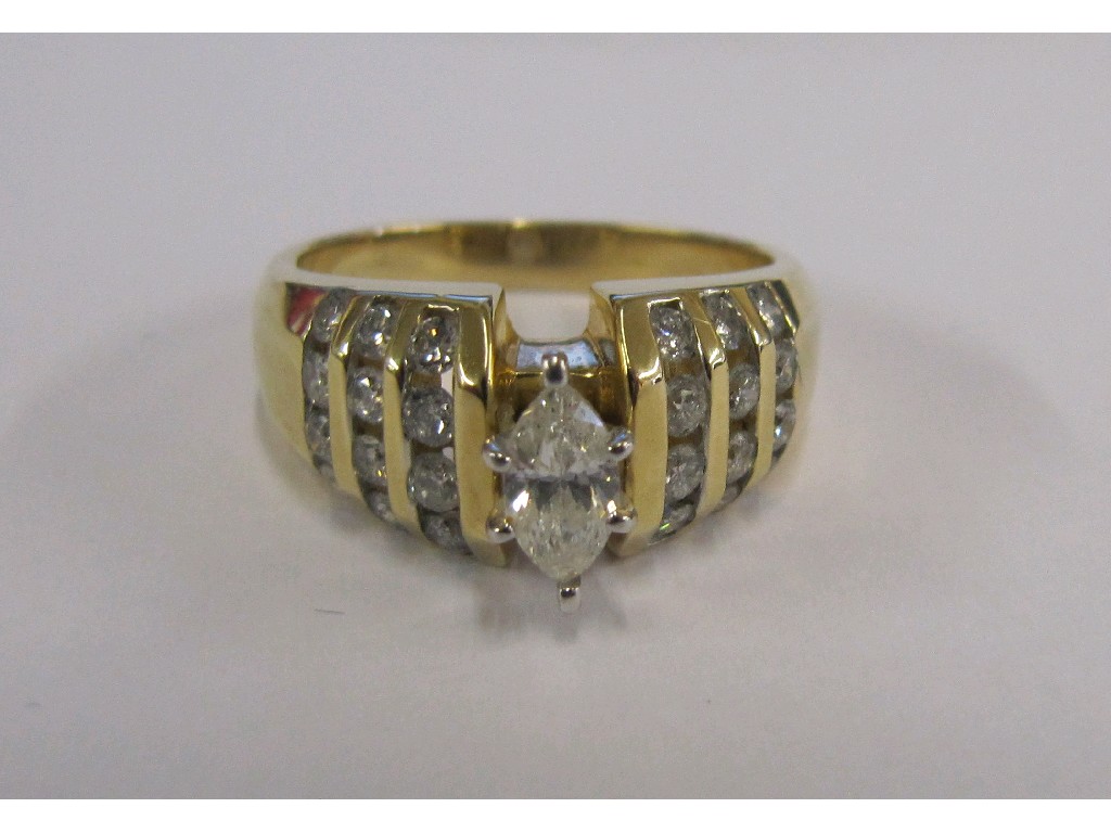 Appraisal: Fourteen carat gold marquise diamond set dress ring with channel