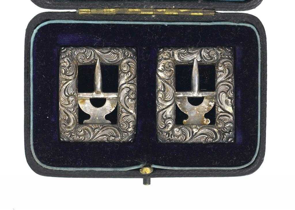 Appraisal: A PAIR OF VICTORIAN SILVER BREECHES BUCKLES chased with scrolling