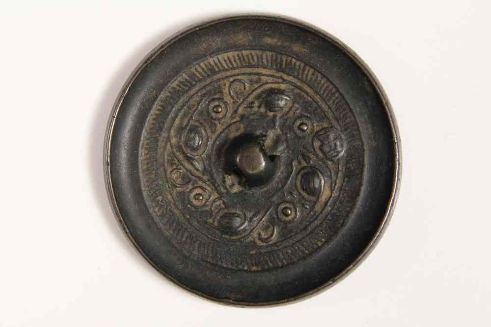 Appraisal: EARLY CHINESE POLISHED BRONZE CIRCULAR MIRROR -Probably Tang Dynasty -pierced