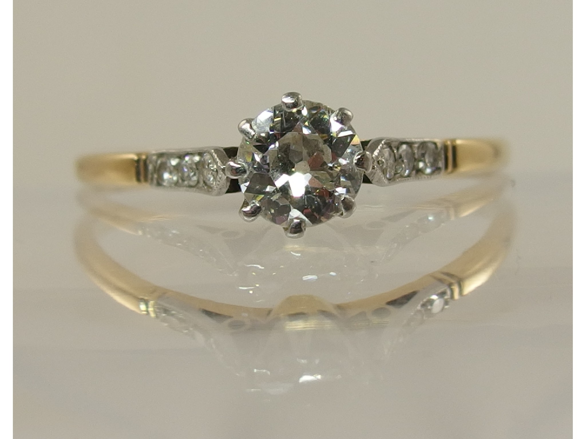 Appraisal: A yellow and white metal old cut diamond solitaire of