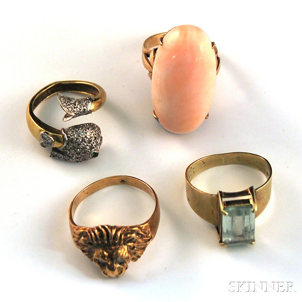 Appraisal: Four Gold Gem-set Rings a kt gold lion's head ring