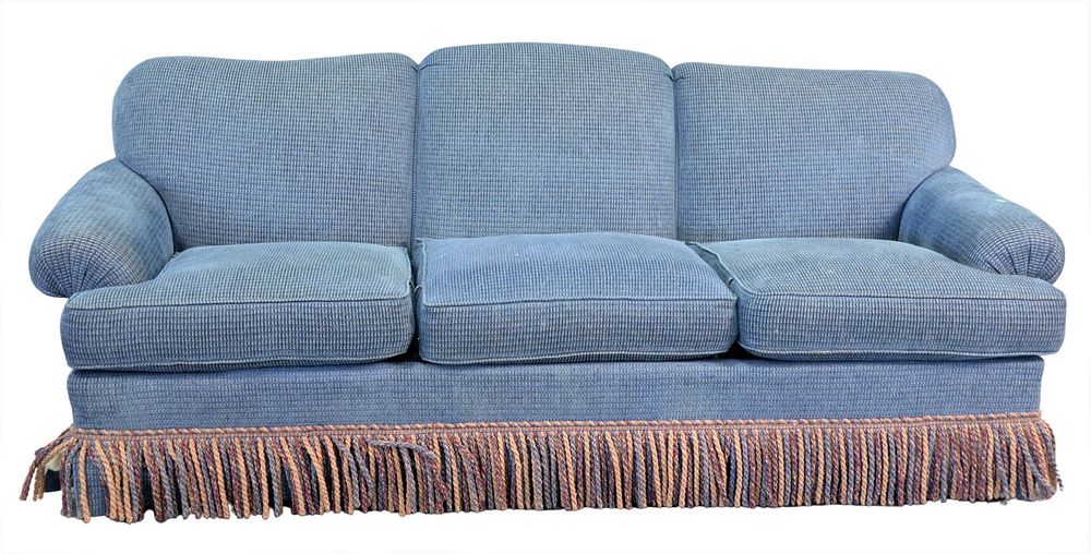 Appraisal: Ashley Manor Upholstered Sofa having blue upholstery with fringe skirt