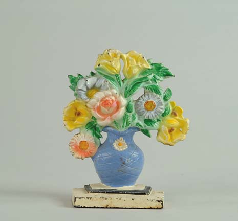 Appraisal: CAST IRON VASE OF FLOWER DOORSTOP Marked on reverse Colorful