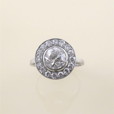 Appraisal: A diamond cluster ring the circular cut diamond is set