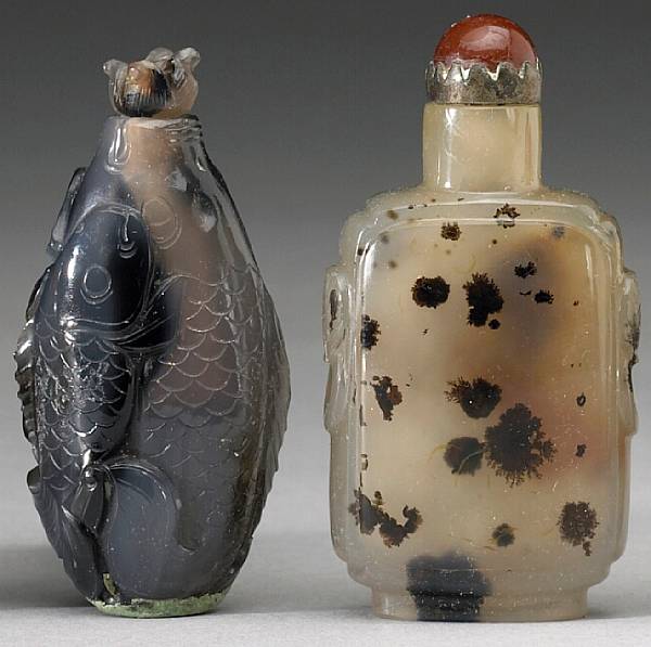 Appraisal: Four agate snuff bottles th Century The first fashioned as