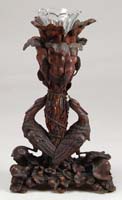 Appraisal: BLACK FOREST WALNUT FIGURAL EPERGNE The tall epergne made of