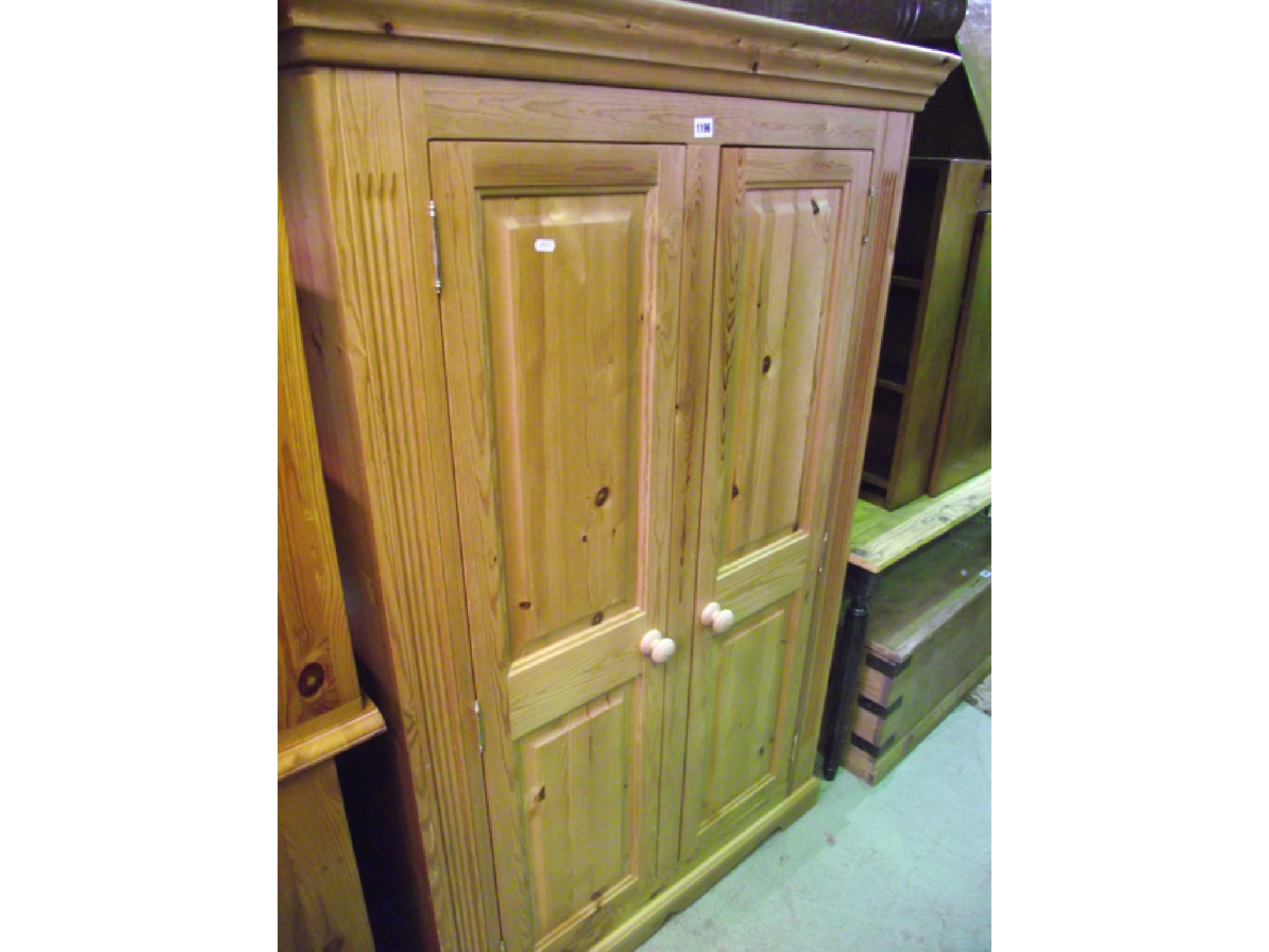 Appraisal: A deep pine cupboard or wardrobe enclosed by two panelled