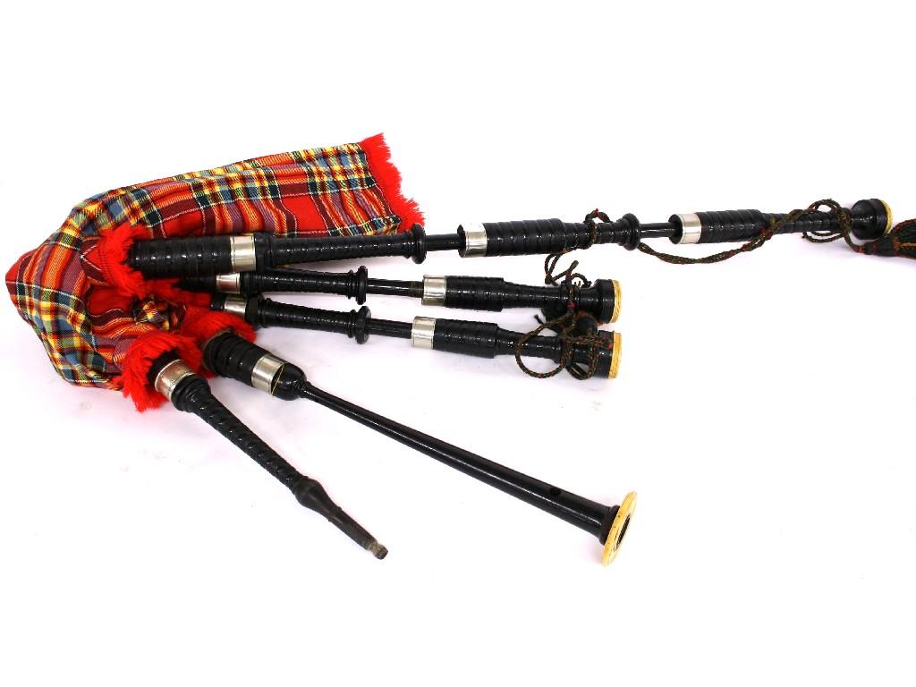 Appraisal: Highland bagpipes with blackwood pipes and tartan bag case