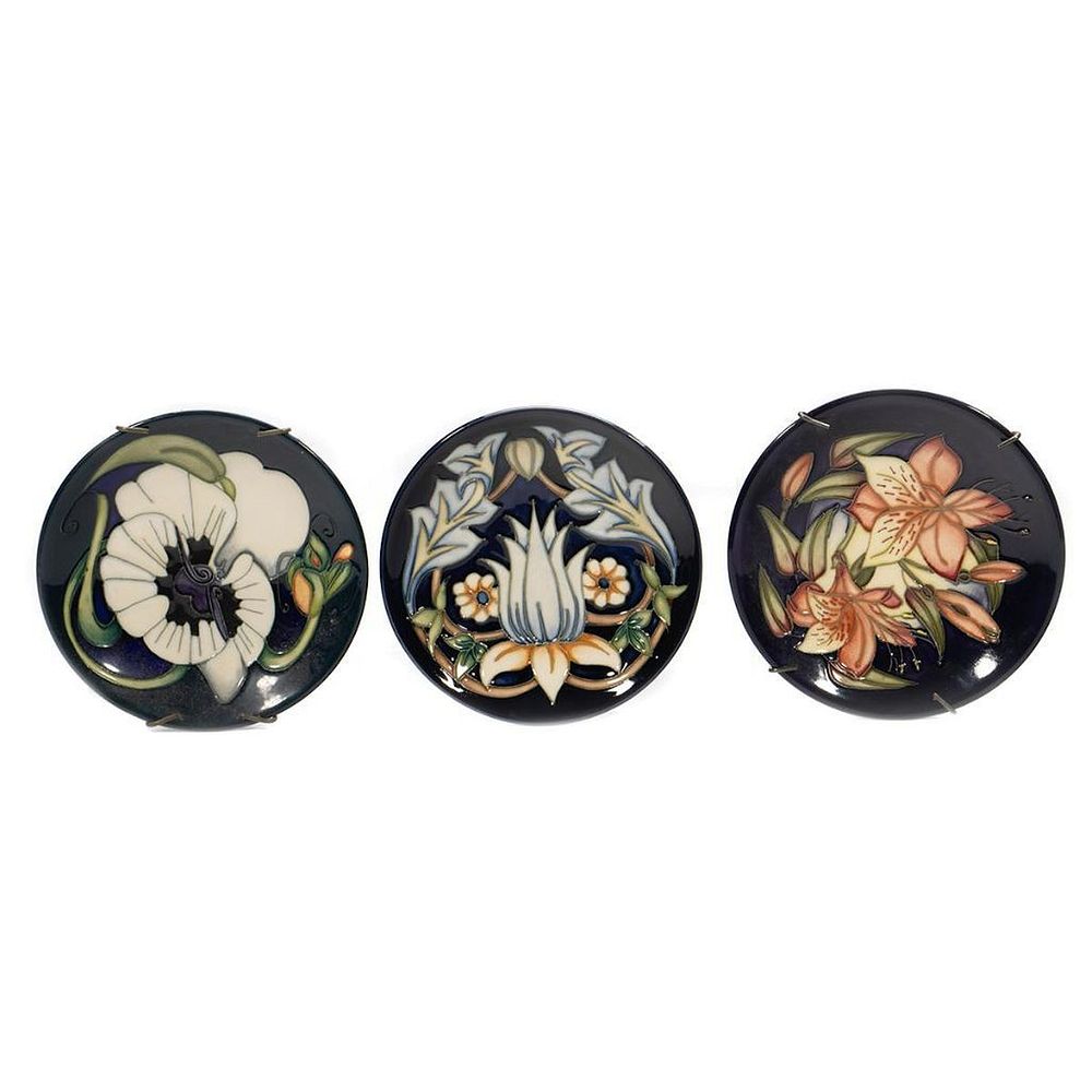 Appraisal: Moorcroft Pottery Saucers A group of three each decorated with