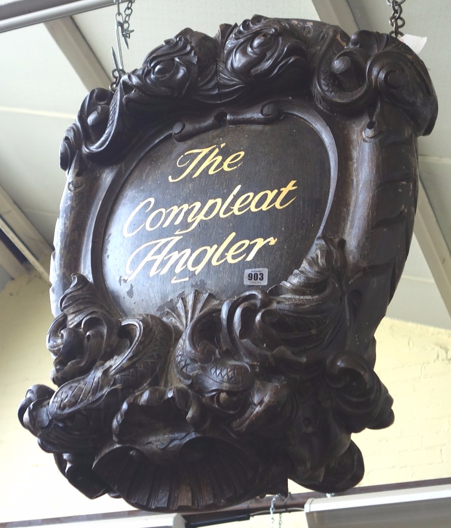 Appraisal: A faux oak shop sign 'The Complete Angler' carved with