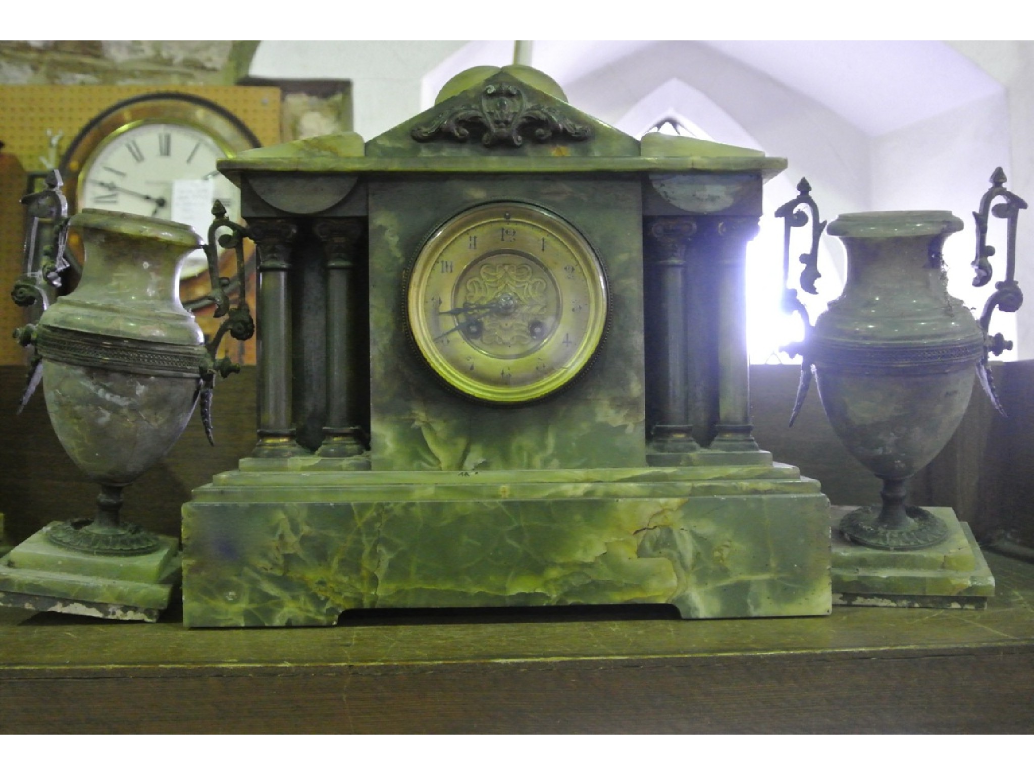 Appraisal: A Victorian onyx clock garniture the clock case of architectural