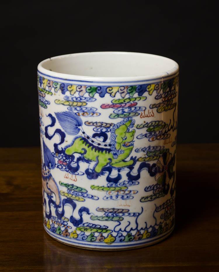 Appraisal: DOUCAI PORCELAIN BRUSH POT with hand painted foo-lion and ribbon