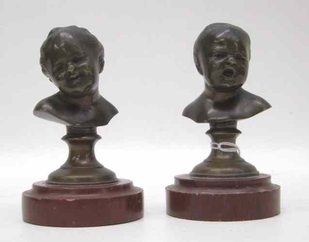 Appraisal: PAIR BRONZE CHILD BUST SCULPTURES After Franz Xaver Messerschmidt German