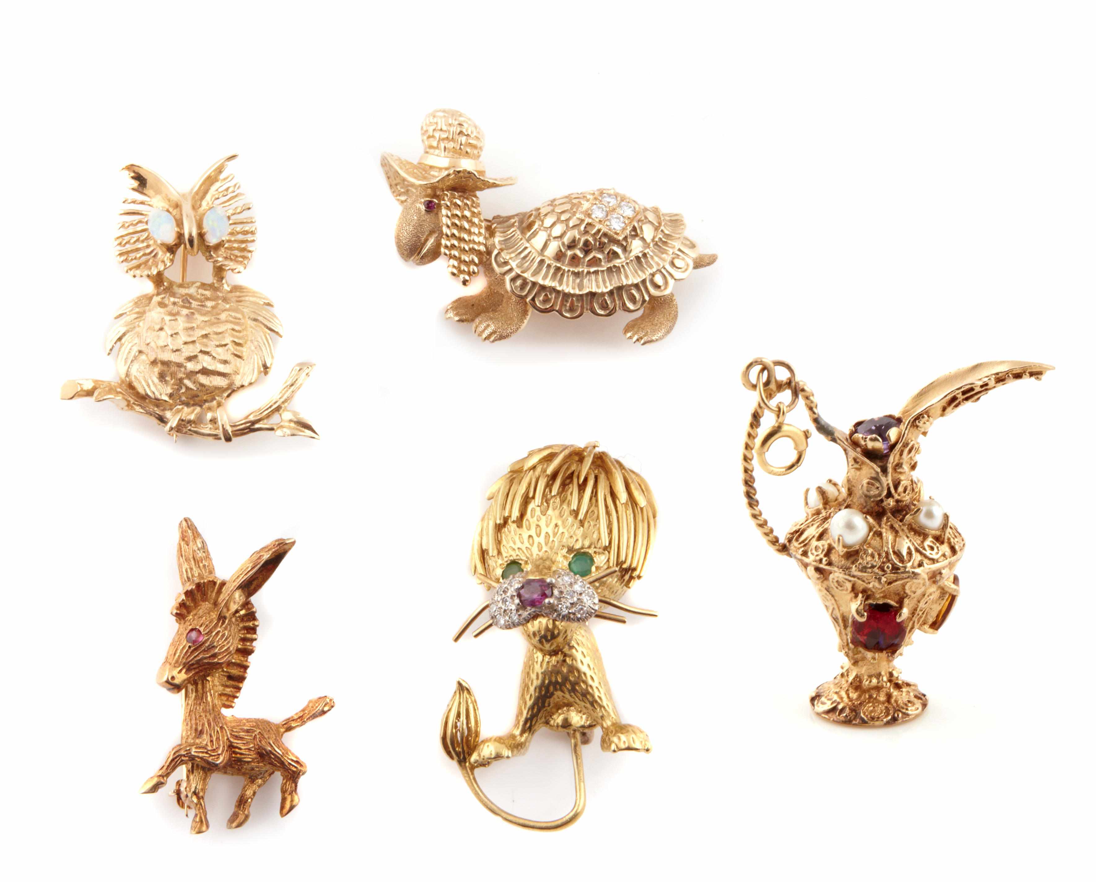 Appraisal: A collection of gem-set diamond and gold brooches comprising motifs