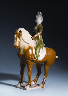 Appraisal: A Chinese sancai-glazed pottery model of a female equestrian raised