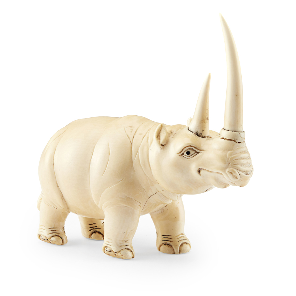 Appraisal: YIVORY CARVING OF A RHINOCEROS naturalistically carved showing the animal