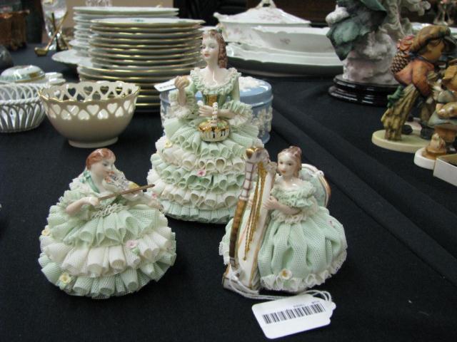 Appraisal: Three Irish Dresden lace figurines from the Emerald collection including