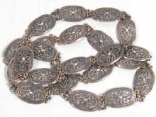 Appraisal: An Eastern white metal tests silver belt comprising linked filigree