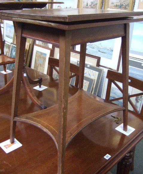 Appraisal: An Edwardian inlaid mahogany card table raised on tapering square